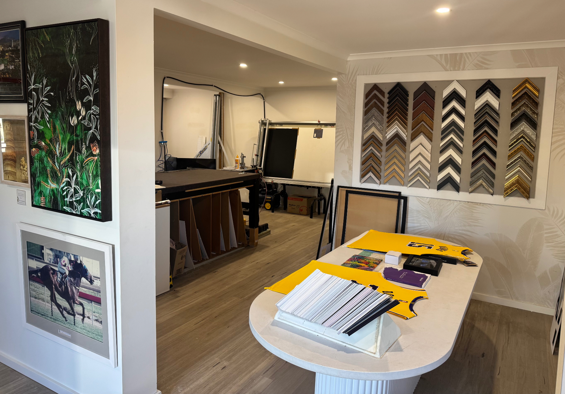 Studio interior with cutting bench and frame samples